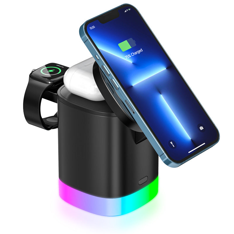 LUME Halo 3-in-1 charging station in black, with iPhone, Apple Watch and AirPods attached